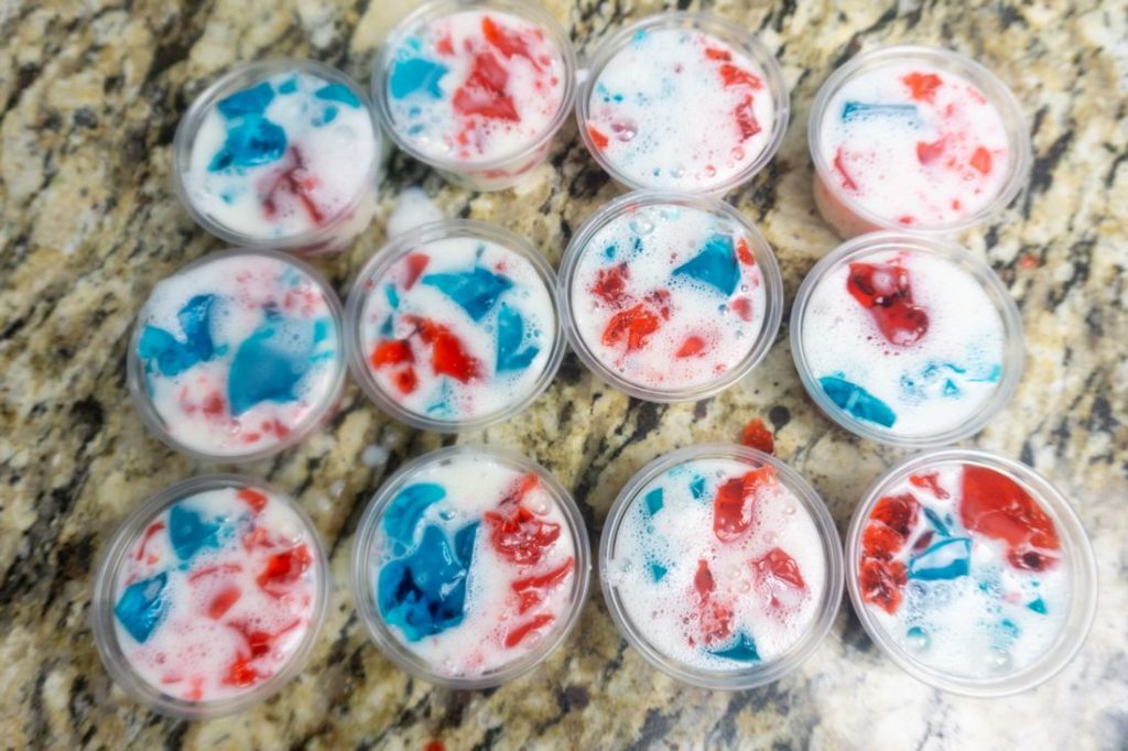 Red and blue jello in jello shot cups