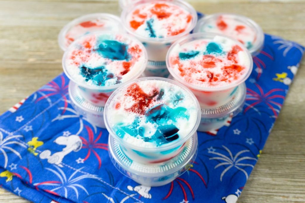 July 4th Stained Glass Jello Shots on snoopy napkin and gray wood