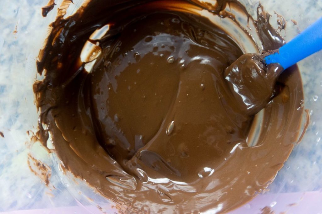 melted Ghirardelli's chocolate in a plastic bowl